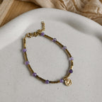 Bracelet Solis en hématite dorée avec touches de pierre naturelle colorée.
