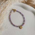 Bracelet Palma en perles naturelles colorées avec accents dorés.